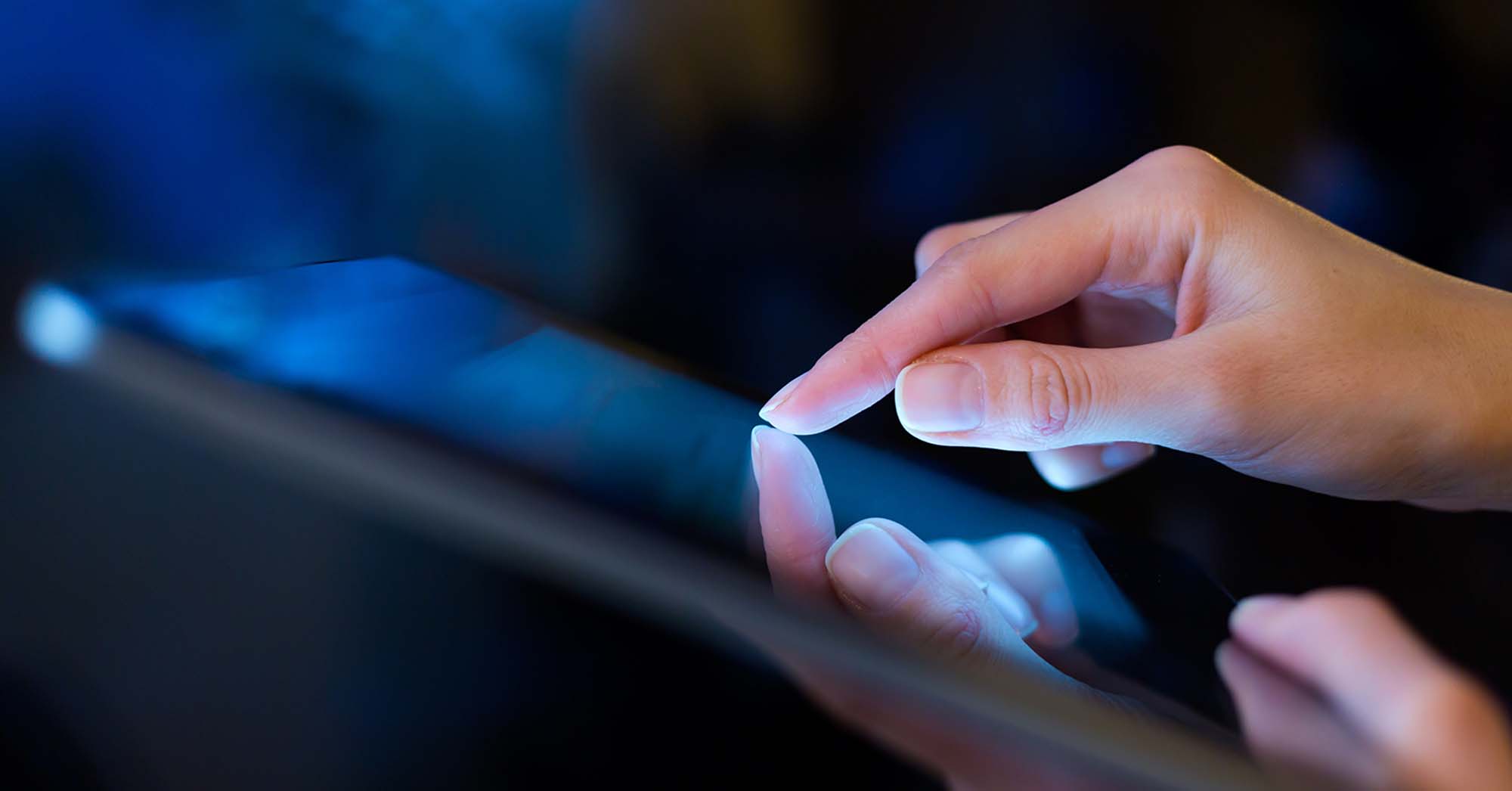 Hand presses on screen digital tablet